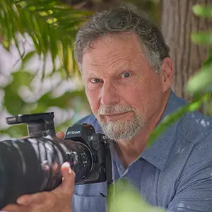 Charles Janson the wildlife photographer and primatologist with his camera.