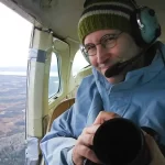 Garth Lenz in a helicopter during a conservation photography assignment.